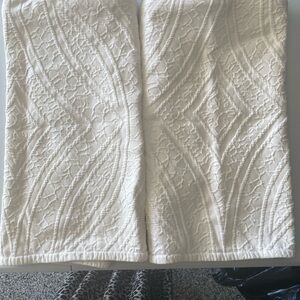 Two king size white metelasse shams